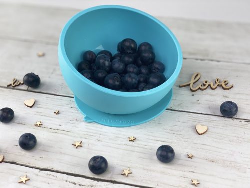 ergonomic silicone baby feeding bowl with suction base - blue - healthy toddler snacks - blueberries