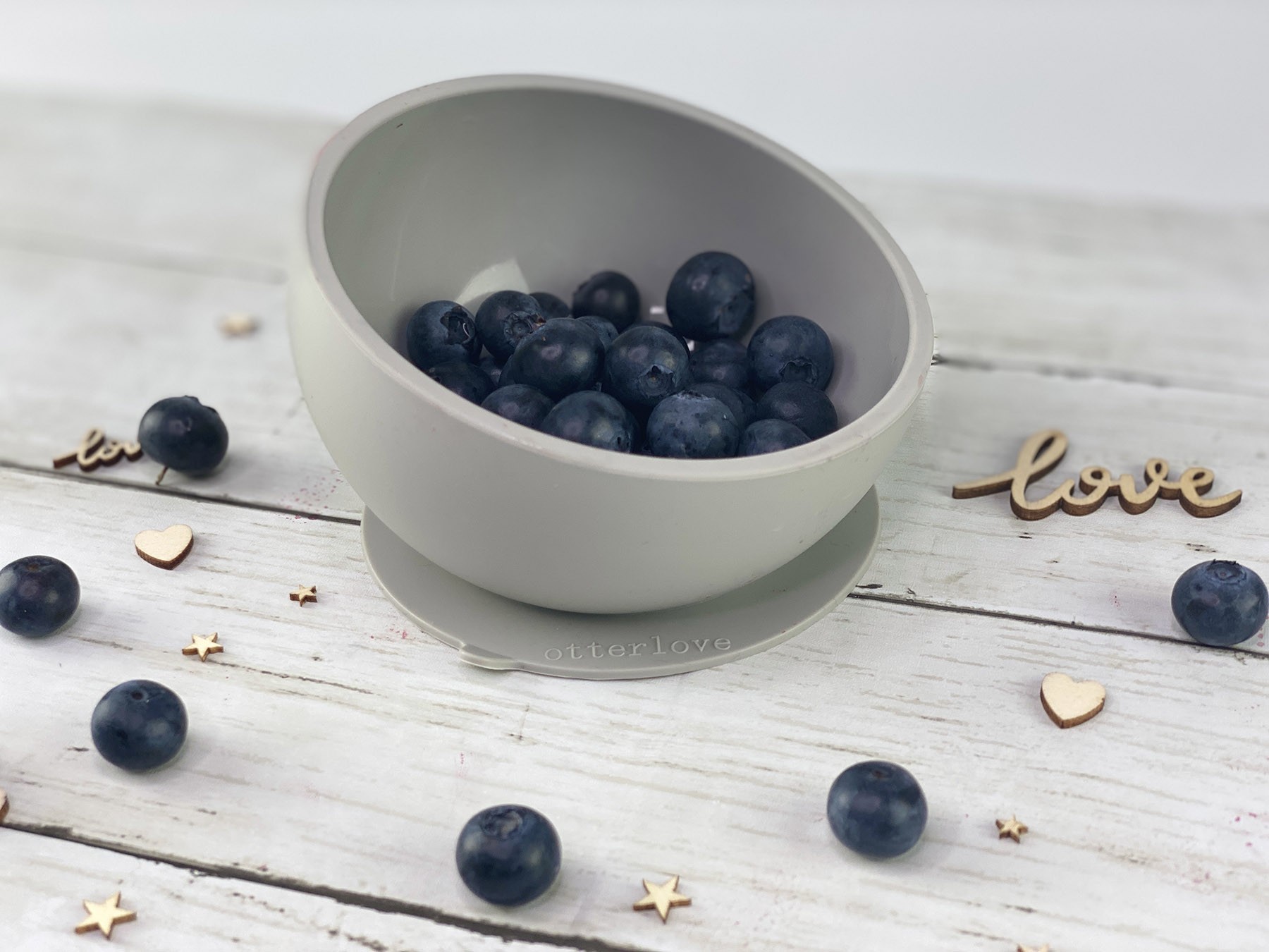 ergonomic silicone baby feeding bowl with suction base - sand - healthy toddler snacks - blueberries