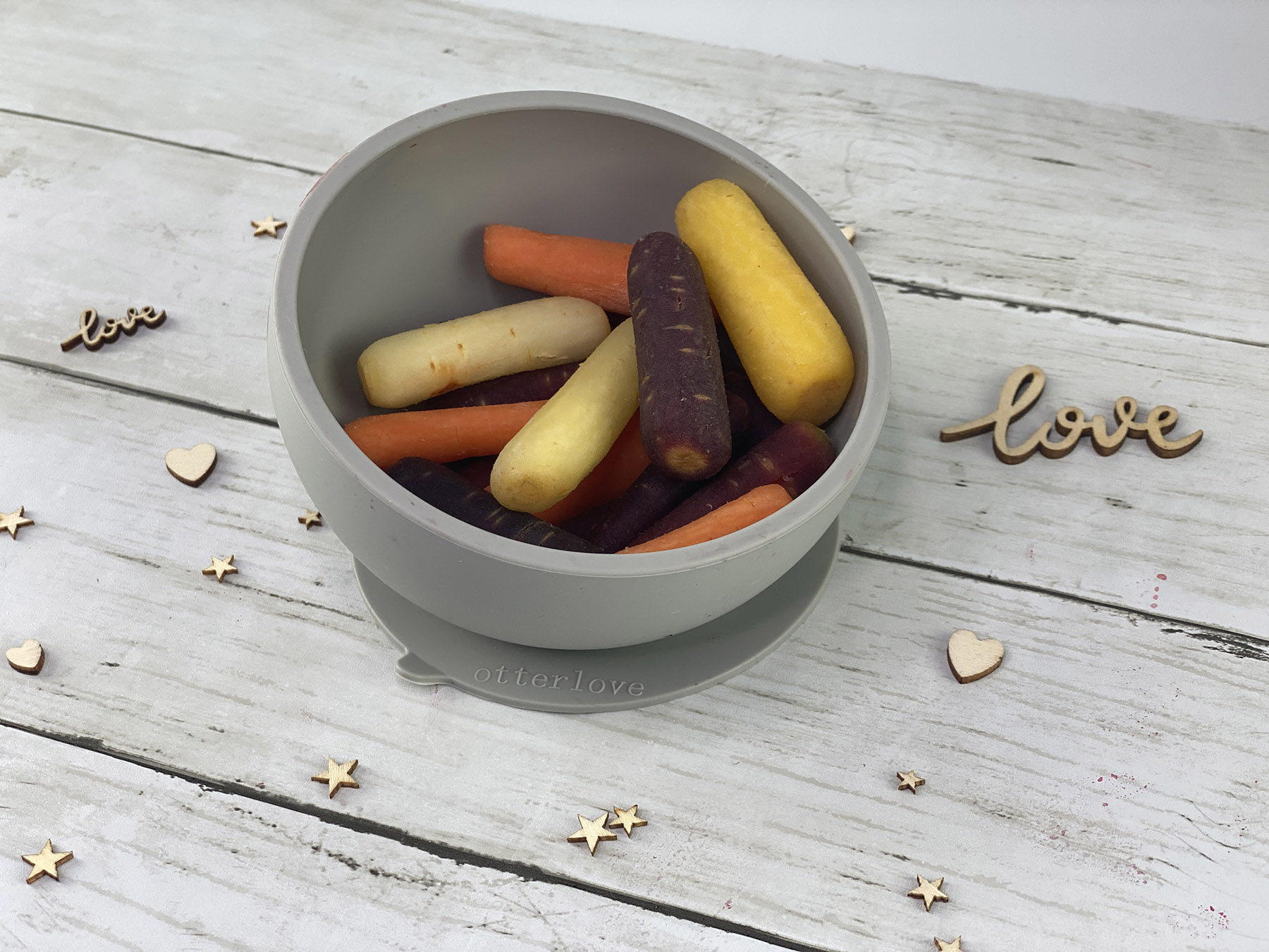 ergonomic silicone baby feeding bowl with suction base - sand - healthy toddler snacks - carrots