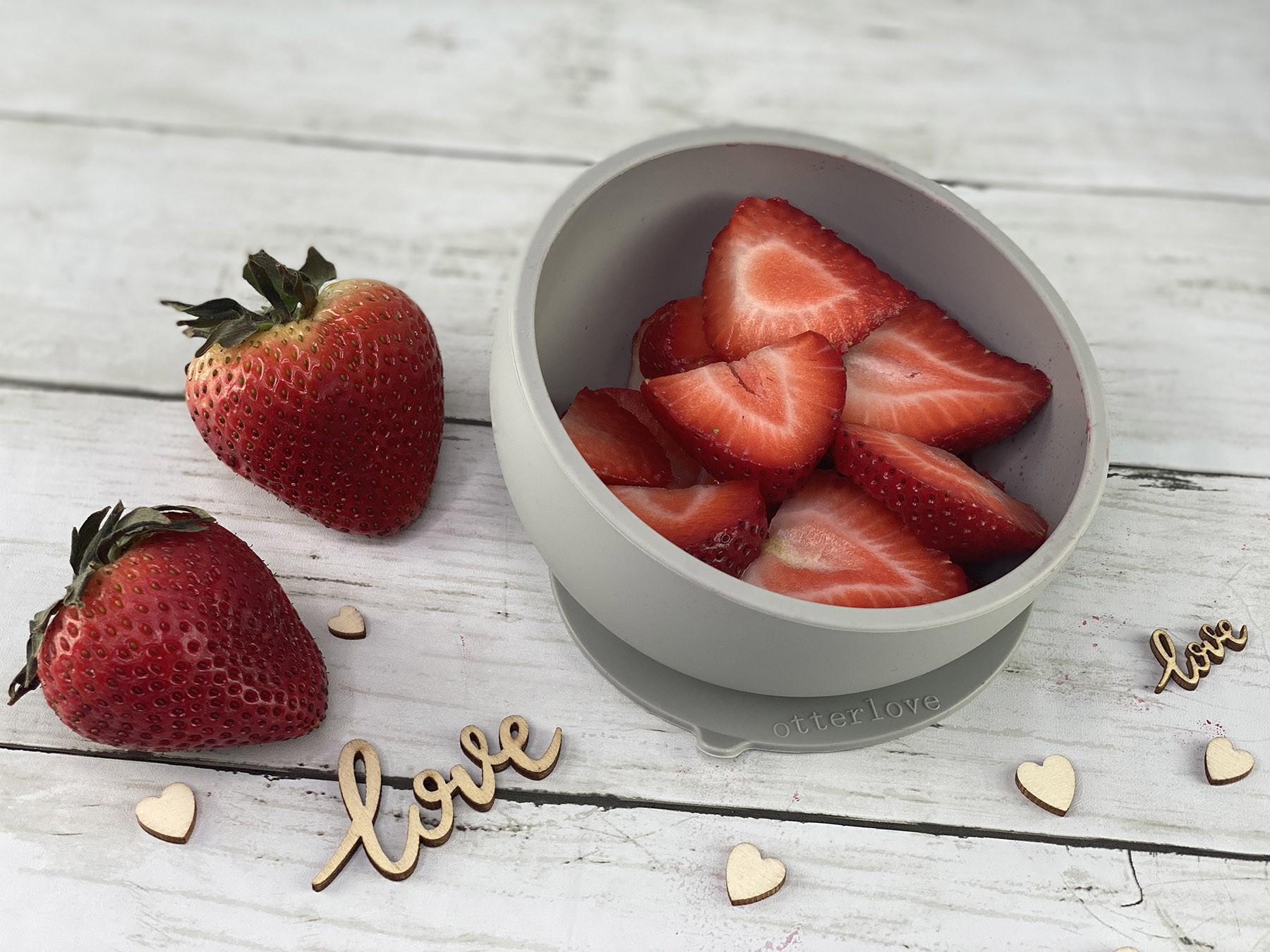 ergonomic silicone baby feeding bowl with suction base - sand - healthy toddler snacks - strawberries
